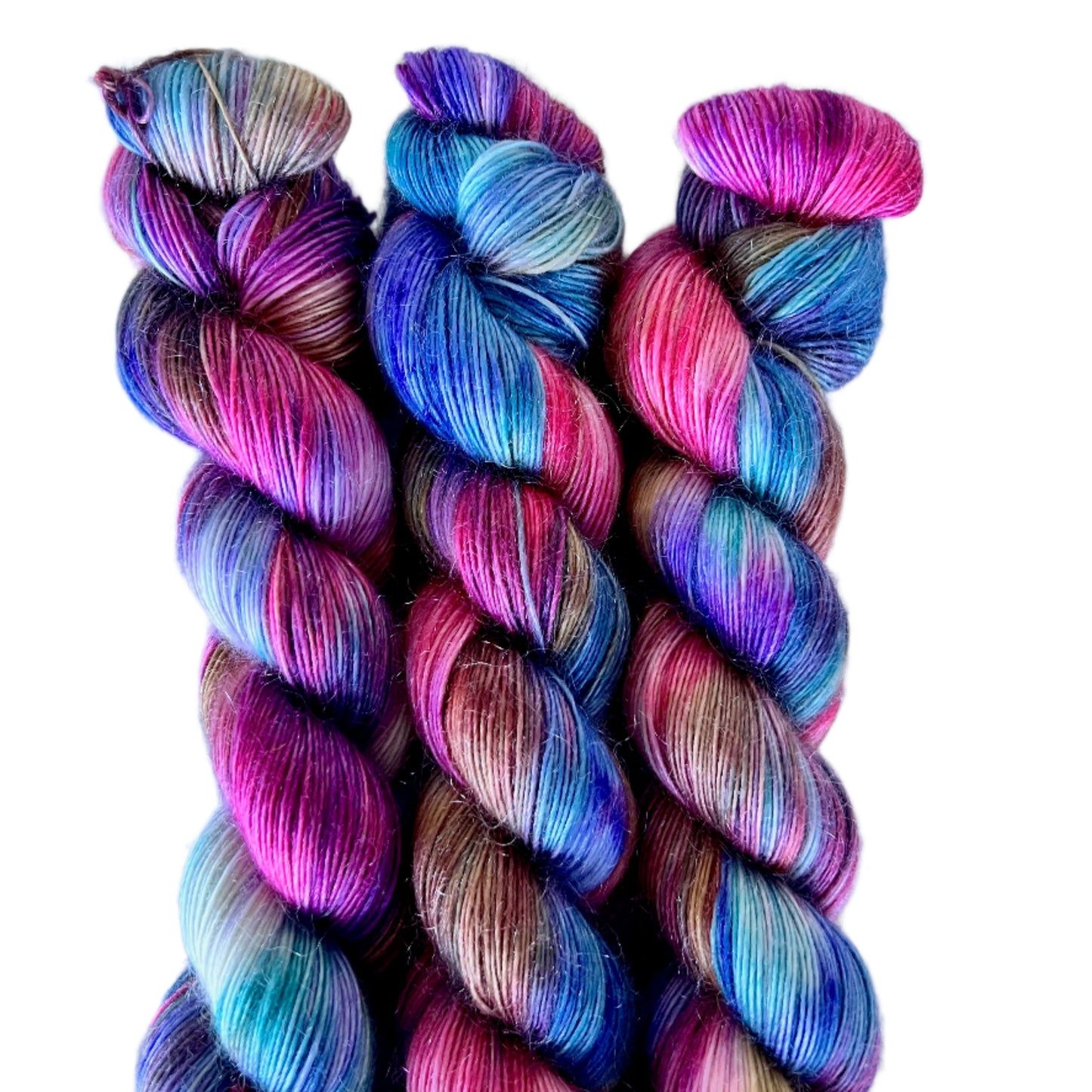Multicolored yarn skeins on a white background