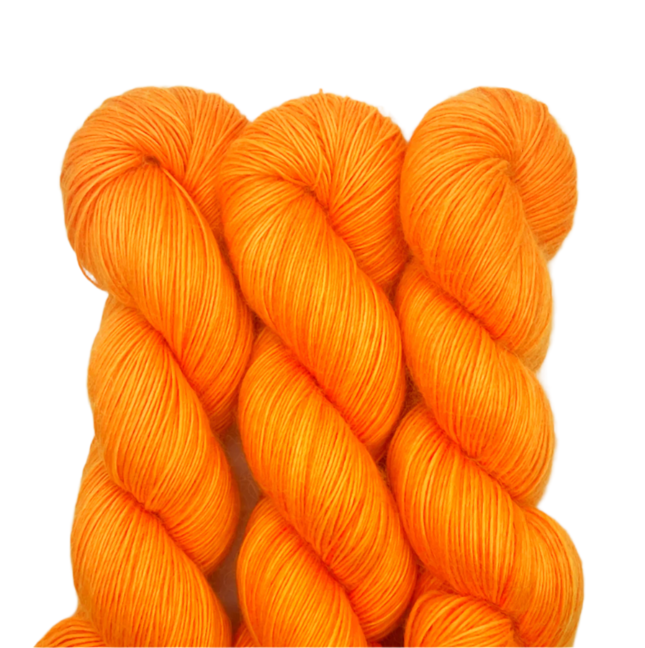 Three skeins bright orange yarn on a white background